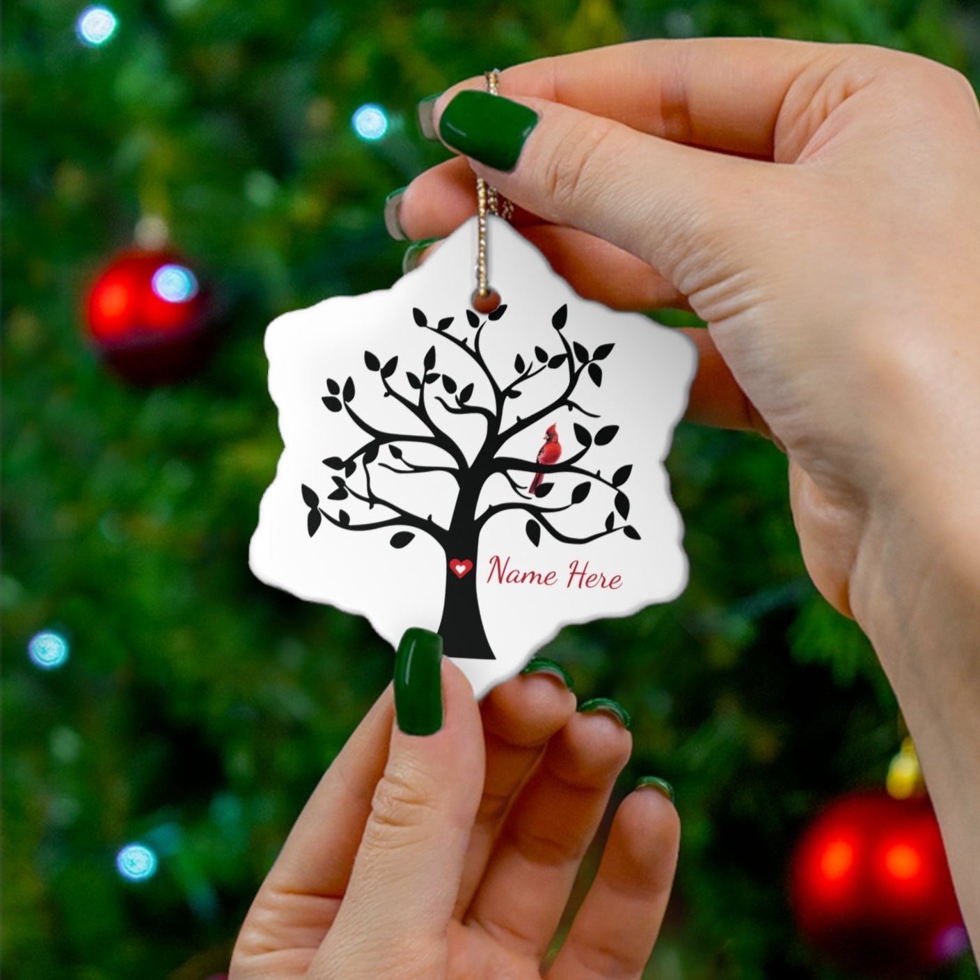 ceramic snowflake ornament with tree and cardinal