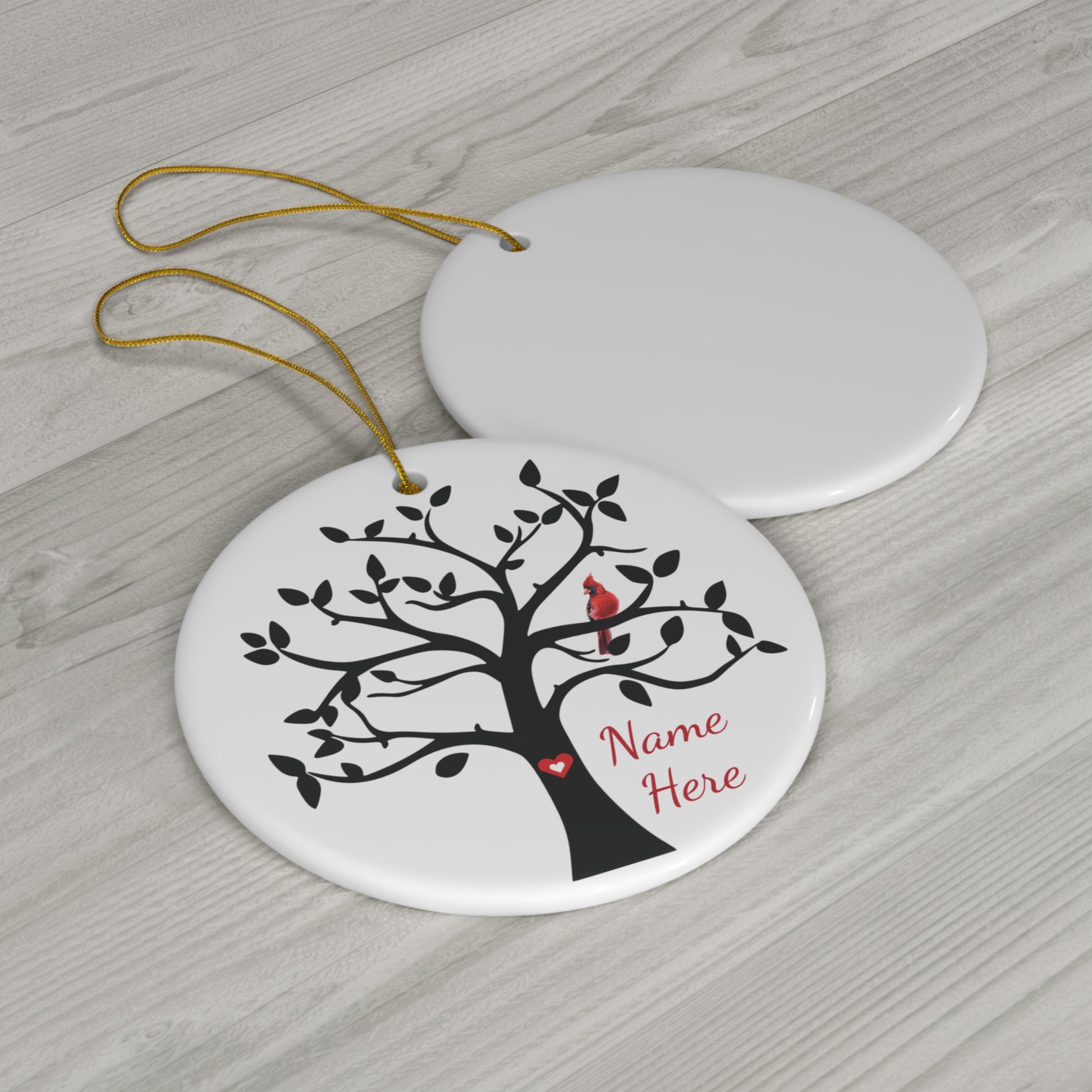 ceramic round ornament with tree and cardinal