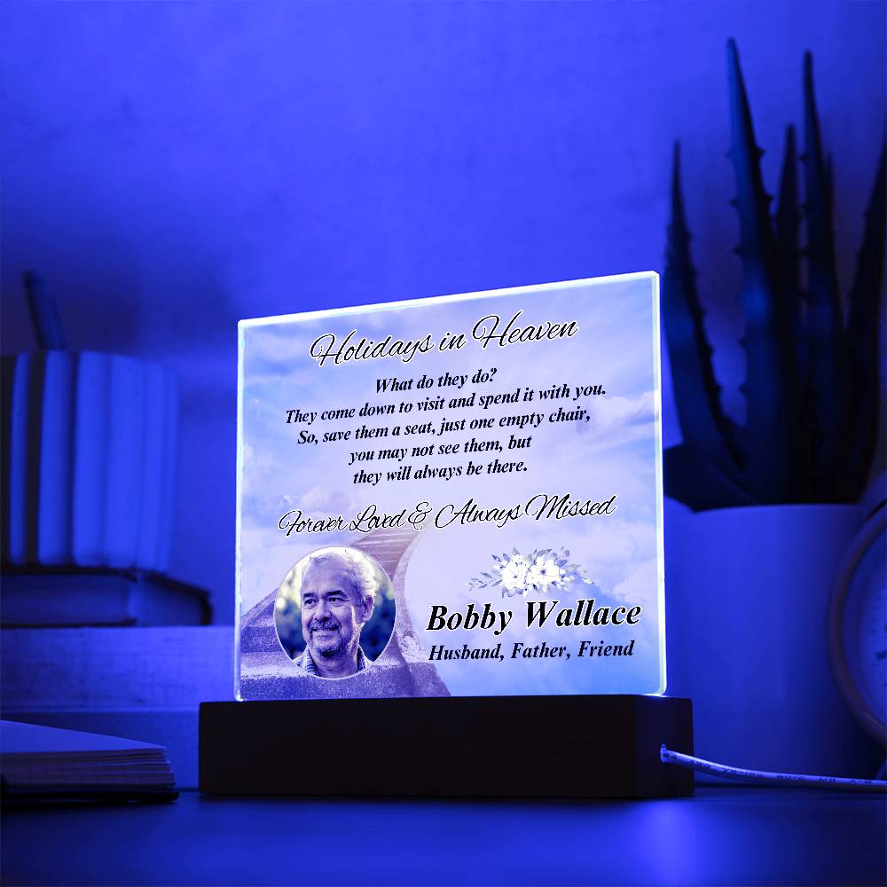 a lighted plaque with a picture of a man on it