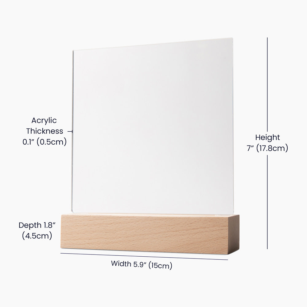 a white board with a wooden base and measurements