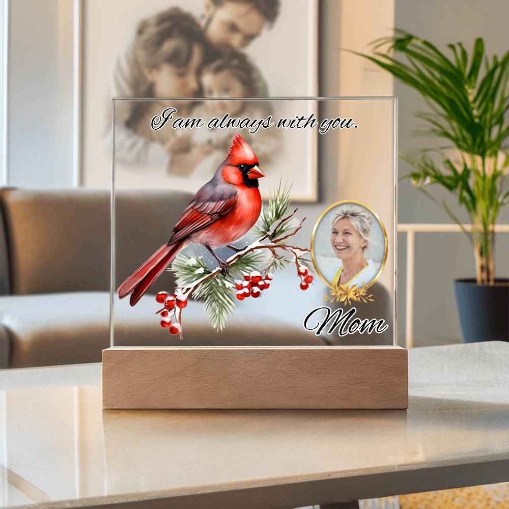 a glass block with a picture of a cardinal on it