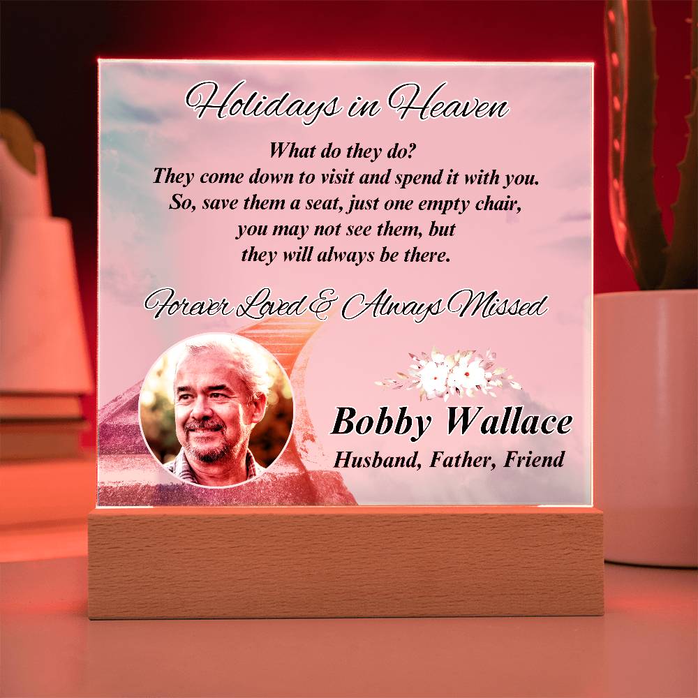 a memorial card with a picture of a man